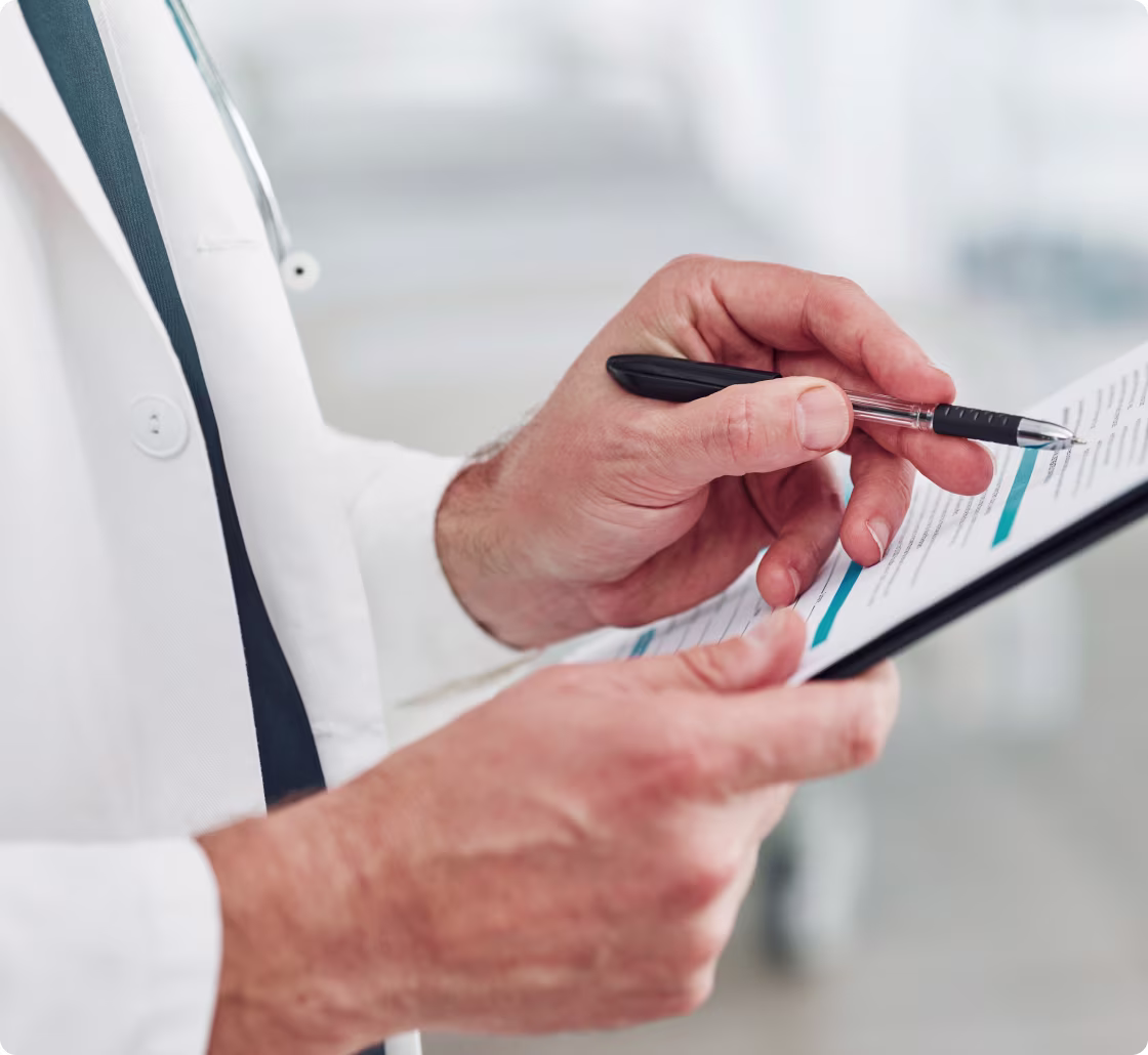 Doctor writing in his notebook