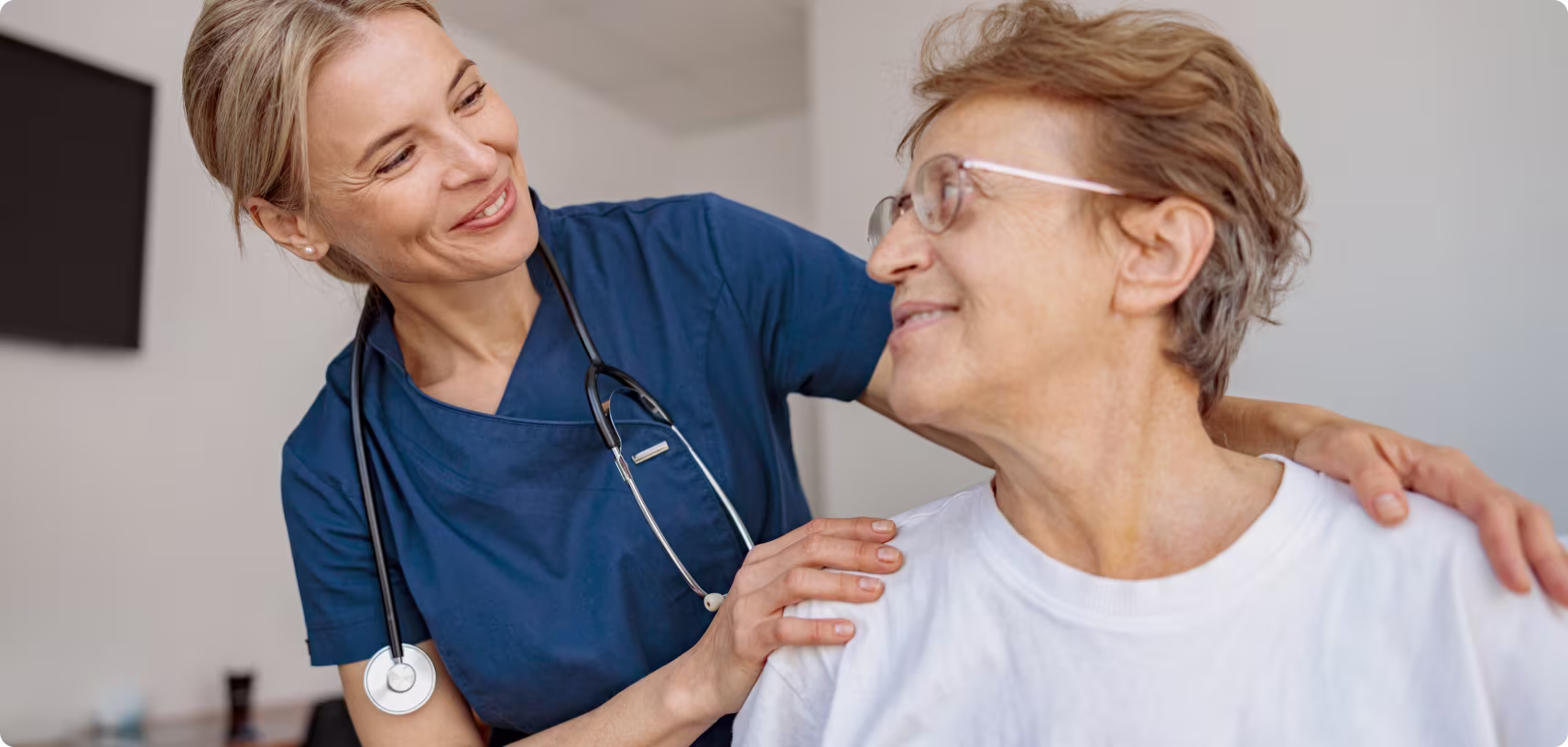 A nurse caring for an elderly person